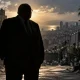 Silhouetted Authority Over City Cleanup
